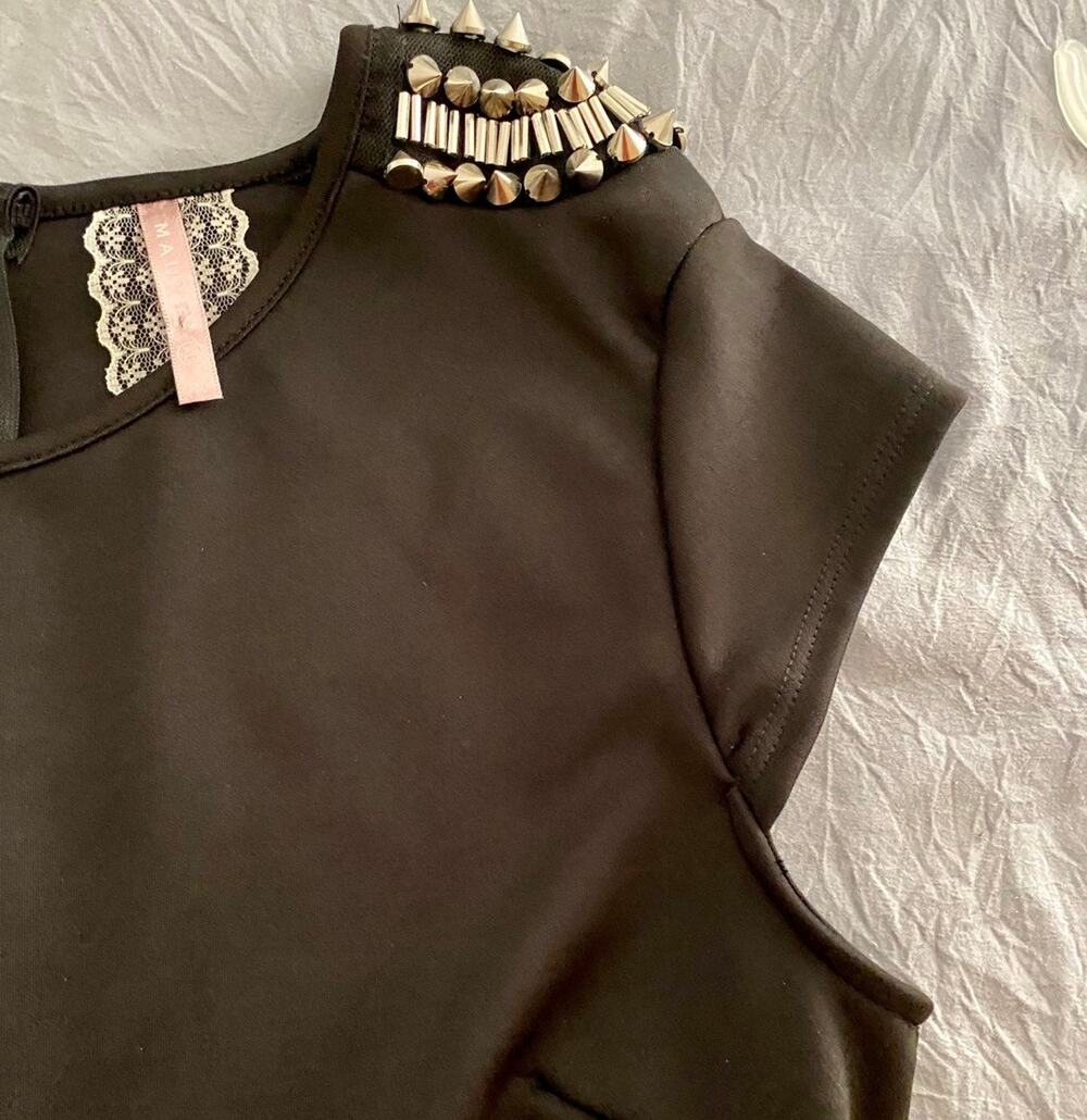 Gorgeous Mauve black peplum top with studded shoulders. XL